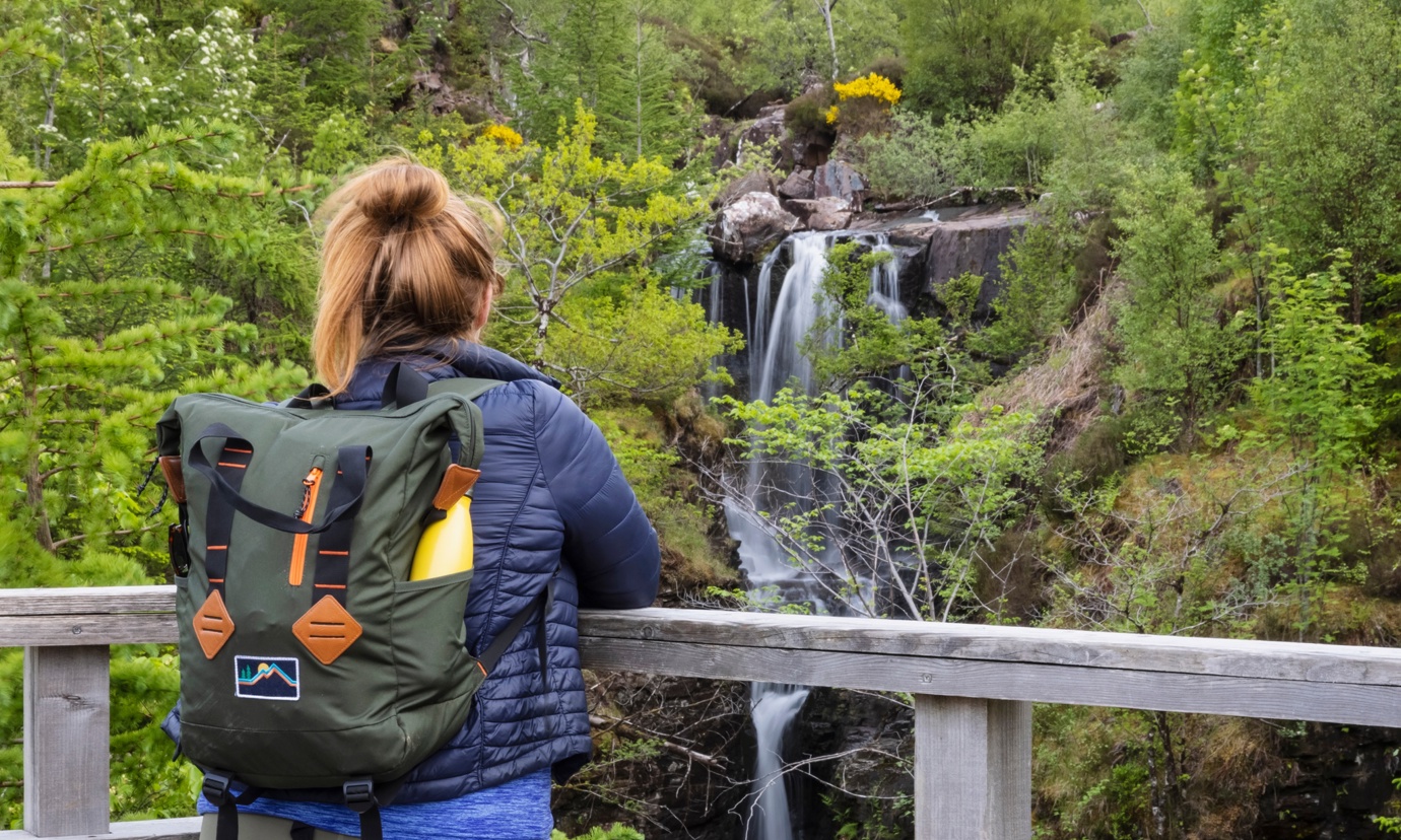 A girl looking over Victoria Falls in Beinn Eighe National Nature Reserve